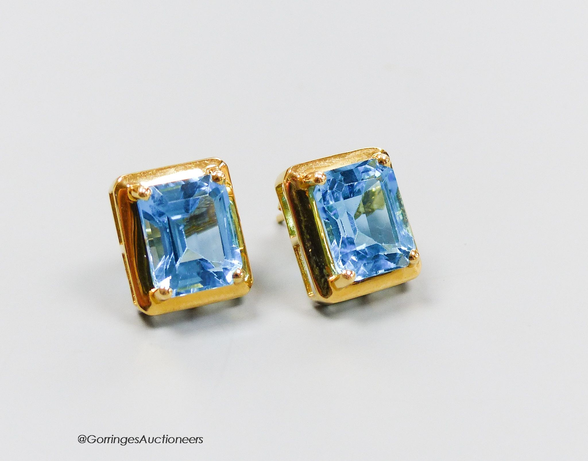 A pair of 18ct gold and topaz earrings, gross 4g.
